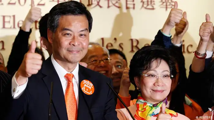 The next Hong Kong Chief Executive Leung Chun-ying celebrates after winning the chief executive election, at a vote counting station in Hong Kong March 25, 2012. An election committee of 1,200 Hong Kong notables picked Beijing-loyalist Leung as the city's next leader on Sunday following an election campaign marred by scandals and a tide of public discontent at a high degree of perceived interference from Beijing over the small circle poll. REUTERS/Tyrone Siu (CHINA - Tags: POLITICS CIVIL UNREST ELECTIONS)