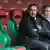 Jos Luhukay and Andreas Rettig sit on the Augsburg bench together