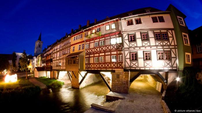 The timber houses atop the Krämerbrücke in Erfurt at night time.