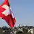 Флаг Швейцарии на фоне Люцерна