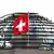 Флаг Швейцарии на фоне здания бундестага