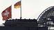 File photo of the Swiss national flag atop of the Swiss embassy in Germany with a German national flag atop of the Reichstag building in Berlin, February 3, 2010. A Swiss decision to pursue German tax inspectors for industrial espionage is a sign of growing tension that could make it hard for both sides to secure parliamentary ratification of a deal preventing Germans dodging tax on their Swiss deposits. While Berlin is trying to tax an estimated 150 billion Swiss francs ($166 billion) hidden by Germans in Swiss accounts, Berne wants to avoid revealing the identities of wealthy customers who are a mainstay of its offshore financial services industry. Both governments say they will sign the deal but its also needs parliamentary approval, and Switzerland's announcement March 31, 2012 that it was pursuing the tax inspectors in a case involving Credit Suisse was hardly a sign of mutual trust. REUTERS/Fabrizio Bensch/Files (GERMANY - Tags: POLITICS BUSINESS) // Eingestellt von wa File photo of the Swiss national flag atop of the Swiss embassy in Germany with a German national flag atop of the Reichstag building in Berlin, February 3, 2010. A Swiss decision to pursue German tax inspectors for industrial espionage is a sign of growing tension that could make it hard for both sides to secure parliamentary ratification of a deal preventing Germans dodging tax on their Swiss deposits. While Berlin is trying to tax an estimated 150 billion Swiss francs ($166 billion) hidden by Germans in Swiss accounts, Berne wants to avoid revealing the identities of wealthy customers who are a mainstay of its offshore financial services industry. Both governments say they will sign the deal but its also needs parliamentary approval, and Switzerland's announcement March 31, 2012 that it was pursuing the tax inspectors in a case involving Credit Suisse was hardly a sign of mutual trust. REUTERS/Fabrizio Bensch/Files (GERMANY - Tags: POLITICS BUSINESS) // Eingestellt von wa