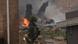 The burning fuselage of an F/A-18 Hornet lies smoldering after crashing into a residential building in Virginia Beach, Va., Friday, April 6, 2012. The burning fuselage of an F/A-18 Hornet lies smoldering after crashing into a residential building in Virginia Beach, Va., Friday, April 6, 2012.