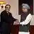 Pakistan President Asif Ali Zardari, left, shakes hands with Indian Prime Minister Manmohan Singh