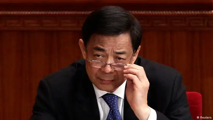 China's Chongqing Municipality Communist Party Secretary Bo Xilai adjusts his glasses during the opening ceremony of the Chinese People's Political Consultative Conference (CPPCC) at the Great Hall of the People in Beijing in this March 3, 2012 file picture. China's Communist Party suspended former high-flying politician Bo from its top ranks and named his wife, Gu Kailai, a suspect in the murder of British businessman Neil Heywood, in revelations on April 10, 2012 likely to shake leadership succession plans. REUTERS/Jason Lee/Files (CHINA - Tags: POLITICS)