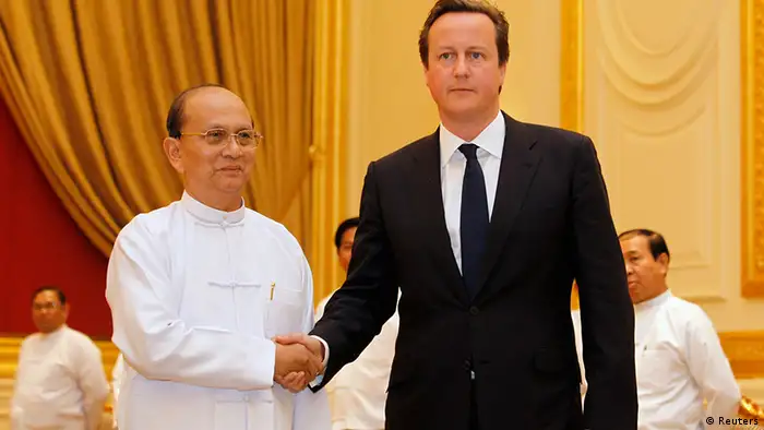 British Prime Minister David Cameron (R) shakes hands with Myanmar's President Thein Sein before their meeting at the President's Office in Naypyitaw April 13, 2012. REUTERS/Soe Zeya Tun (MYANMAR - Tags: POLITICS)