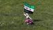 A Syrian refugee runs with a Syrian opposition flag during a demonstration against Syria's President Bashar al-Assad, outside the Syrian embassy in Amman April 13, 2012. REUTERS/Ali Jarekji (JORDAN - Tags: POLITICS TPX IMAGES OF THE DAY) A Syrian refugee runs with a Syrian opposition flag during a demonstration against Syria's President Bashar al-Assad, outside the Syrian embassy in Amman April 13, 2012. REUTERS/Ali Jarekji (JORDAN - Tags: POLITICS TPX IMAGES OF THE DAY)