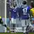 Sebastian Kehl (left) of Borussia Dortmund reacts after scoring his team's second goal