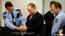 Defendant Norwegian mass killer Anders Behring Breivik (C) has his handcuffs removed after arriving for his trial in a courtroom in Oslo April 16, 2012. The terrorism and murder trial against Breivik, who has confessed to the bomb and shooting attacks that killed 77 people in Norway in July 2011, begins in Oslo on Monday. REUTERS/Fabrizio Bensch (NORWAY - Tags: CRIME LAW IMAGE OF THE DAY TOP PICTURE)