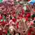 Red Shirts protesters react during a rally at the Democracy Monument