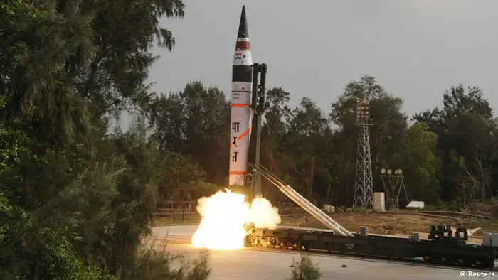 A surface-to-surface Agni V missile is launched from the Wheeler Island off the eastern Indian state of Odisha April 19, 2012. India test-fired the long range missile capable of reaching deep into China and Europe on Thursday, thrusting the emerging Asian power into an elite club of nations with intercontinental nuclear weapons capabilities. A scientist at the launch site said the launch was successful, minutes after television images showed the rocket with a range of more than 5,000 km (3,100 miles) blasting through clouds from the Wheeler Island off Odisha coast. REUTERS/Indian Defence Research and Development Organisation/DRDO/Handout (INDIA - Tags: MILITARY) FOR EDITORIAL USE ONLY. NOT FOR SALE FOR MARKETING OR ADVERTISING CAMPAIGNS