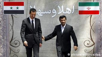 Iranian President Mahmoud Ahmadinejad (r) welcomes his Syrian counterpart Bashar al-Assad at the presidential palace in Tehran, Iran, on 19 August 2009 . Syrian President Bashar al-Assad arrived 19 August in Tehran for a one-day visit and started talks with his Iranian counterpart, Mahmoud Ahmadinejad, in the presidential office. EPA/ABEDIN TAHERKENAREH +++(c) dpa - Report+++ --- 2012_04_20_syrien_iran.psd