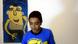 Mostapha (13 years) with on of his painting Mostapha (13 years) with on of his painting