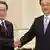 In this photo released by China's Xinhua News Agency, Chinese President Hu Jintao, right, greets North Korean envoy Kim Yong Il, head of the international department of the Workers' Party of Korea, during their meeting in Beijing Monday, April 23, 2012. The meeting was held in a reaffirmation of traditional ties following Chinese pique over Pyongyang's recent attempted rocket launch. (Foto:Xinhua, Li Xueren/AP/dapd) NO SALES