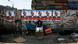 An Egyptian girl street vendor displays dairy products for sale under electoral posters An Egyptian girl street vendor displays dairy products for sale under electoral posters