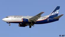 ** FILE ** In this Feb. 2, 2007 file photo an Aeroflot subsidiary Boeing-737-500 passenger jet, the same model as the one that crashed Sunday, Sept. 14, 2008, on the outskirts of Perm, is seen flying into Moscow's Sheremetyevo airport. The Boeing-737-500 passenger jet, which was operated by an Aeroflot subsidiary, traveling from Moscow to the Ural Mountain city of Perm crashed as it was preparing to land early Sunday, killing all 88 people aboard, officials said, citing engine failure as a possible cause. (ddp images/AP Photo/Michael Volchenkov, File)