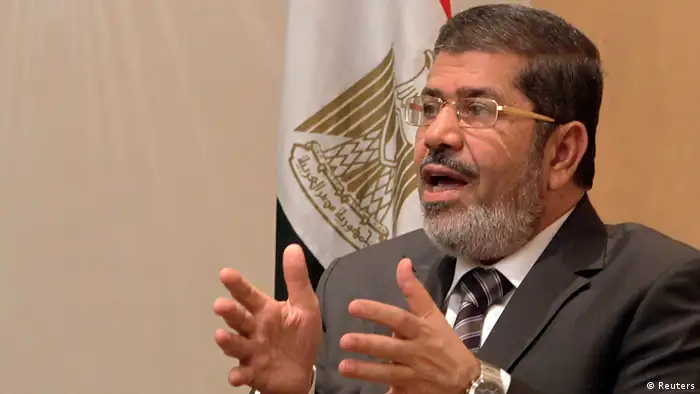 Mohamed Mursi, head of Muslim Brotherhood's political party, and Brotherhood's new presidential candidate, talks during interview with Reuters in Cairo.