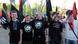Ukrainian and Russian neo-Nazis raise arms in a Nazi salute during nationalist march in the memory of the so-called Galychyna Division, in Ukraine's western city of Lviv on Saturday, April 28, 2012. The 14th Waffen Grenadier Division of the SS, called also Galychyna Division, was a World War II German military formation initially made up of volunteers from the region of Galycia with a Ukrainian ethnic background but later also incorporated Slovaks, Czechs and Dutch volunteers and officers. Formed in 1943, it was surrendered to the Western Allies by 10 May 1945. In the background are Galychyna Division flags. Lviv is one of Ukraine's four cities that will co-host with Poland the Euro 2012 soccer tournament. (Foto:Petro Zadorozhnyy/AP/dapd) Ukrainian and Russian neo-Nazis raise arms in a Nazi salute during nationalist march in the memory of the so-called Galychyna Division, in Ukraine's western city of Lviv on Saturday, April 28, 2012. The 14th Waffen Grenadier Division of the SS, called also Galychyna Division, was a World War II German military formation initially made up of volunteers from the region of Galycia with a Ukrainian ethnic background but later also incorporated Slovaks, Czechs and Dutch volunteers and officers. Formed in 1943, it was surrendered to the Western Allies by 10 May 1945. In the background are Galychyna Division flags. Lviv is one of Ukraine's four cities that will co-host with Poland the Euro 2012 soccer tournament. (Foto:Petro Zadorozhnyy/AP/dapd)