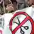 Demonstrators Pamplona display banner that shows a no-symbol over a pair of scissors