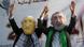 The Palestinian don masks of President Mahmoud Abbas and Hamas leader Ismail Haniya's faces The Palestinian don masks of President Mahmoud Abbas and Hamas leader Ismail Haniya's faces