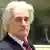 Former Bosnian Serb leader Radovan Karadzic enters the courtroom of the U.N.'s Yugoslav war crimes tribunal in The Hague, Netherlands, Tuesday Nov. 3, 2009. Radovan Karadzic appeared in the courtroom for the first time since his trial began last week on charges of ordering Serb atrocities throughout the Bosnian war. Karadzic has boycotted the trial's first three days, saying he has not had enough time to prepare his defense even though he was indicted in 1995. (ddp images/AP Photo/Michael Kooren/Pool)
