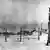Das Foto zeigt einen Blick auf das Arbeitslager Workuta 120 km noerdlich des Polarkreises, ab 1931 von Zwangsarbei tern gebaut. Wachturm und Wohnba- racken. - Foto, 1930er / 1940er Jahre. E: Vorkuta Gulag / Photo / 1930s/1940s