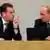 Russia's President Vladimir Putin (R) speaks with former President and prime ministerial candidate Dmitry Medvedev at a session of the Russian State Duma in Moscow May 8, 2012. Putin asked Russia's lower house on Tuesday to confirm his ally Medvedev as prime minister in a job swap that has angered many Russians and sparked protests against the men's grip on power. REUTERS/Maxim Shemetov (RUSSIA - Tags: POLITICS)