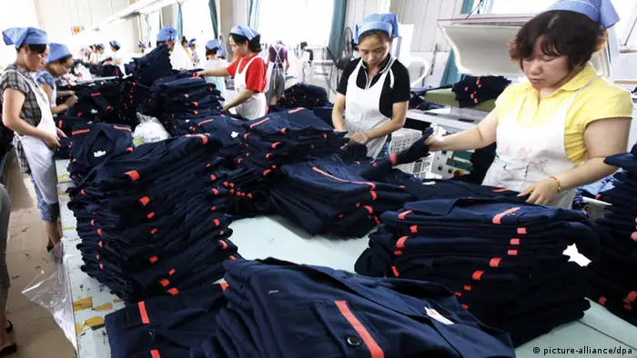 Labors work at a clothing factory on August 1, 2011 in Huaibei, Anhui Province of China. China's Manufacturing sector Purchasing Managers Index (PMI) fell to 50.7 percent in July from 50.9 in June, a 29-month record low since March of 2009, according to the China Federation of Logistics and Purchasing (CFLP) on Monday. Photo: ChinaFotoPress/Wuhe/MAXPPP