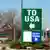 A huge green sign that says TO USA with an arrow