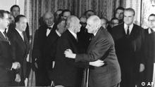 German Chancellor Konrad Adenauer, left, hugs France President Charles de Gaulle, right, after signing the Elysee friendship treaty in the Elysee palace in Paris, France on Jan. 22, 1963. France and Germany kicked off celebrations Wednesday, Jan. 22, 2003 to mark the 40th anniversary of the treaty with a raft of events intended to inject new vitality into their relationship, which is pivotal in efforts to expand and integrate the European Union. (ddp images/AP Photo) --- Bundeskanzler Konrad Adenauer (li) und Staatspraesident Charles de Gaulle umarmen sich nach der Unterzeichnung des Deutsch-Franzoesischen Vertrages am 22. Januar 1963 im Salon Murat im Pariser Elysee-Palast. Rechts neben de Gaulle steht M. Christian Fouchet. (ddp images/AP Photo)