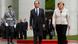 German Chancellor Angela Merkel and French President Francois Hollande review the guard of honour at the Chancellery in Berlin, May 15, 2012. Hollande called for a European pact for growth to balance out German-driven austerity measures in his inaugural address on Tuesday, hours before taking his challenge to Chancellor Angela Merkel in Berlin. Sworn in with all the pomp of the French Republic, Hollande won support from Germany's opposition Social Democrats (SPD), who vowed to use their parliamentary blocking power to delay ratifying a European budget discipline treaty until Merkel accepts accompanying measures to boost growth and jobs. REUTERS/Thomas Peter (GERMANY - Tags: POLITICS) German Chancellor Angela Merkel and French President Francois Hollande review the guard of honour at the Chancellery in Berlin, May 15, 2012. Hollande called for a European pact for growth to balance out German-driven austerity measures in his inaugural address on Tuesday, hours before taking his challenge to Chancellor Angela Merkel in Berlin. Sworn in with all the pomp of the French Republic, Hollande won support from Germany's opposition Social Democrats (SPD), who vowed to use their parliamentary blocking power to delay ratifying a European budget discipline treaty until Merkel accepts accompanying measures to boost growth and jobs. REUTERS/Thomas Peter (GERMANY - Tags: POLITICS)