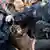 Polizisten tragen einen Demonstranten bei der Räumung des Occupy-Camps vor der Europäischen Zentralbank (EZB) in Frankfurt am Main am Mittwoch (16.05.2012) aus dem Camp. Ein Teil der Campbewohner hatte sich der Räumung widersetzt und die anrückende Polizei mit Farbe attackiert. Das Camp liegt in der Sicherheitszone um die EZB und musste wegen befürchteter Ausschreitungen bei den "Blockupy-Aktionstagen" vorübergehend geräumt werden. Foto: Boris Roessler dpa/lhe +++(c) dpa - Bildfunk+++