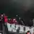 Fans zünden schwarze Rauchbomben in der Kurve im Stadion (Foto: dapd)
