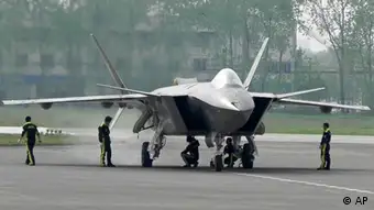 In this Sunday, April 17, 2011 photo, Chinese Air Force ground crew members inspect a J-20 stealth fighter in Chengdu, in southwest China's Sichuan province. (AP Photo) CHINA OUT