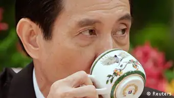 Taiwan President Ma Ying-jeou takes a sip from a cup during a news conference after his inauguration ceremony at the Presidential Office in Taipei May 20, 2012. Ma took office on Sunday for his second term. REUTERS/Pichi Chuang (TAIWAN - Tags: POLITICS)