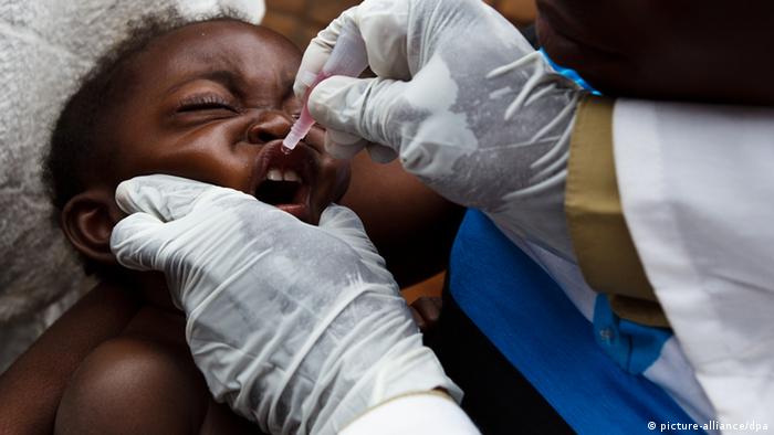 A child in Congo receiving an oral vaccine against polio 