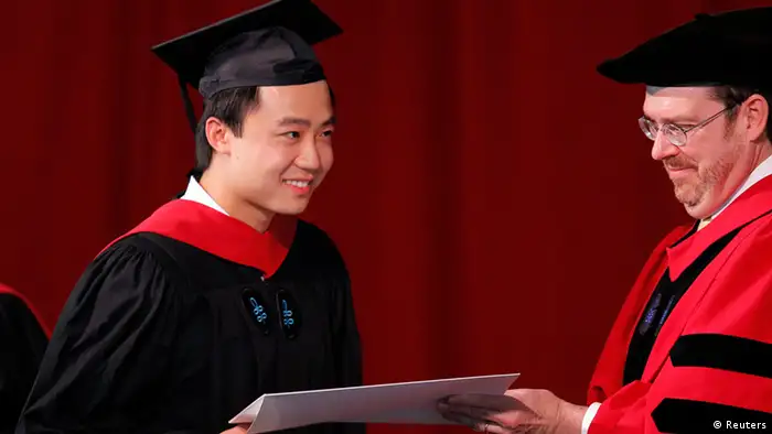 Bo Guagua, son of fallen Chinese politician Bo Xilai, receives his masters degree in public policy from Senior Lecturer John Donohue (R) at the John F. Kennedy School of Government during the 361st Commencement Exercises at Harvard University in Cambridge, Massachusetts May 24, 2012. Bo graduated from Harvard University's Kennedy School of Government on Thursday, capping a tumultuous academic year that also placed him in the center of his homeland's biggest leadership crisis in two decades. REUTERS/Brian Snyder (UNITED STATES - Tags: EDUCATION POLITICS)