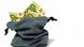 A full sack, with 100-euro notes poking bulging out of the top A full sack, with 100-euro notes poking bulging out of the top
