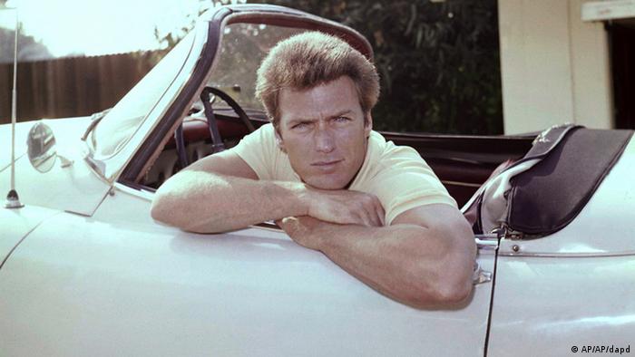 Clint Eastwood hanging over the door of a car