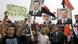 Syrian regime supporters hold up Bashar Assad's portrait and a man holds up a banner that reads "Thank China and Russia" during a rally in Umayyad Square in downtown Damascus, Syria, Wednesday Oct. 26, 2011. Tens of thousands of Syrians packed a Damascus square Wednesday in a show of support for embattled President Bashar Assad, a few hours ahead of a visit by senior Arab officials probing ways to start a dialogue between the regime and the opposition. (ddp images/AP Photo/Muzaffar Salman) Syrian regime supporters hold up Bashar Assad's portrait and a man holds up a banner that reads "Thank China and Russia" during a rally in Umayyad Square in downtown Damascus, Syria, Wednesday Oct. 26, 2011. Tens of thousands of Syrians packed a Damascus square Wednesday in a show of support for embattled President Bashar Assad, a few hours ahead of a visit by senior Arab officials probing ways to start a dialogue between the regime and the opposition. (ddp images/AP Photo/Muzaffar Salman)