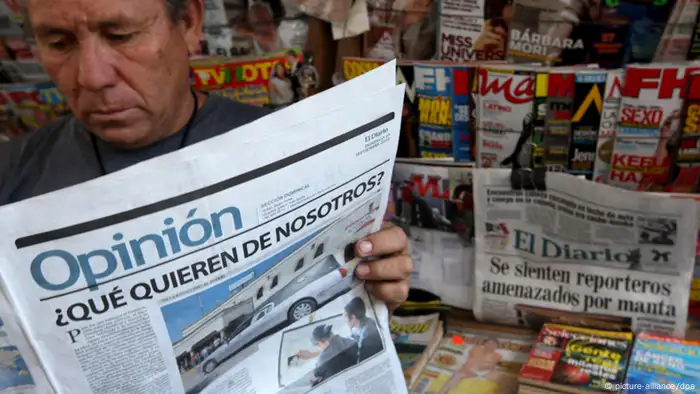 A man in Mexico reads a newspaper.
