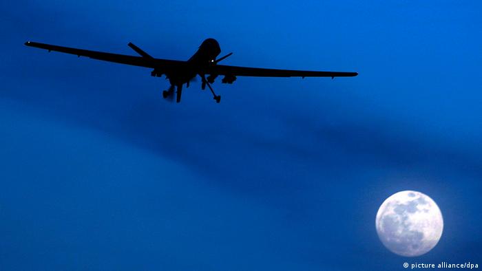 In this Jan. 31, 2010 file photo an unmanned U.S. Predator drone flies over Kandahar Air Field, southern Afghanistan, on a moon-lit night.