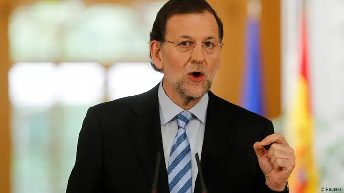 Spain's Prime Minister Mariano Rajoy gestures during a news conference at the Moncloa Palace in Madrid, June 10, 2012. Spanish Prime Minister Rajoy said on Sunday that Spain had avoided a full-on rescue for its sovereign debt due to his deficit cutting measures and economic reforms. On Saturday the euro zone agreed to lend Spain up to 100 billion euros for its banks. REUTERS/Paul Hanna (SPAIN - Tags: POLITICS BUSINESS)