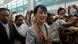 Myanmar's pro-democracy leader Aung San Suu Kyi makes her way through the Yangon International Airport as she leaves for her trip to Europe June 13, 2012. REUTERS/Minzayar (MYANMAR - Tags: POLITICS) Myanmar's pro-democracy leader Aung San Suu Kyi makes her way through the Yangon International Airport as she leaves for her trip to Europe June 13, 2012. REUTERS/Minzayar (MYANMAR - Tags: POLITICS)