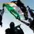 Free Syrian Army members raise their weapons and a revolutionary flag (Photo: AP/dapd)