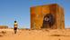 Man walking past a mural in Dajla refugee camp, western Algeria. Man walking past a mural in Dajla refugee camp, western Algeria.