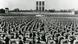 Das Bild steht symbolisch für NS-Zeit: Der 6.Reichspartei- tag der NSDAP im September 1934 in Nürnberg mit weiter über 100.000 SA- und SS-Männern. Im Hintergrund drei riesige Hakenkreuz-Fahnen. Das Bild steht symbolisch für NS-Zeit: Der 6.Reichspartei- tag der NSDAP im September 1934 in Nürnberg mit weiter über 100.000 SA- und SS-Männern. Im Hintergrund drei riesige Hakenkreuz-Fahnen.
