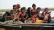 Rohingya refugees from Myanmar sit on a boat as they try to get into Bangladesh in Teknaf June 13, 2012. The UN Refugee Office (UNHCR) has called on Bangladesh to keep its borders open given the rapid escalation of violence in the northern Rakhine State of Myanmar, UN spokesman Martin Nesirky told reporters on Tuesday. REUTERS/Andrew Biraj (BANGLADESH - Tags: SOCIETY IMMIGRATION CIVIL UNREST) TEMPLATE OUT Rohingya refugees from Myanmar sit on a boat as they try to get into Bangladesh in Teknaf June 13, 2012. The UN Refugee Office (UNHCR) has called on Bangladesh to keep its borders open given the rapid escalation of violence in the northern Rakhine State of Myanmar, UN spokesman Martin Nesirky told reporters on Tuesday. REUTERS/Andrew Biraj (BANGLADESH - Tags: SOCIETY IMMIGRATION CIVIL UNREST) TEMPLATE OUT