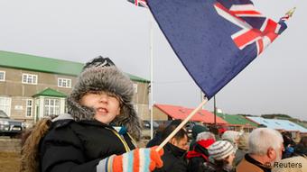 A child waves a Falklands flag in Stanley June 14, 2012, during commemorations for the 30th anniversary of the Falklands War