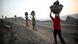 Laborers carry baskets of coal illegally from an open-cast mine in the village of Bokapahari in the eastern Indian state of Jharkhand Laborers carry baskets of coal illegally from an open-cast mine in the village of Bokapahari in the eastern Indian state of Jharkhand